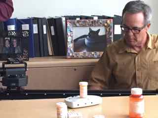 60 minutes photographer and talking pill bottle