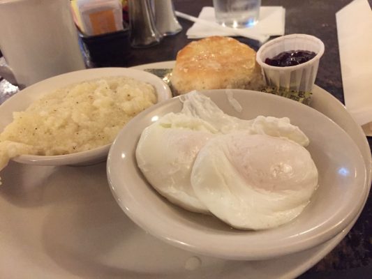 poached eggs, grits, and biscuit