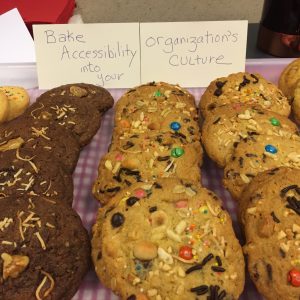 multi-ingredied cookies with sign reading "Bake Accessibility into Your Organization
