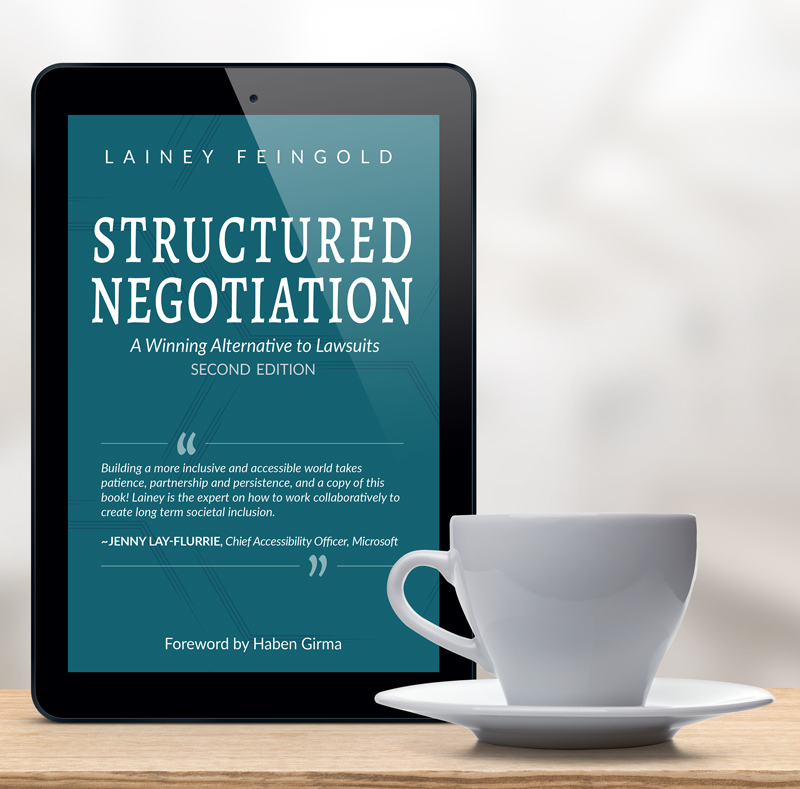 Structured Negotiation cover on an ipad with a cup of coffee