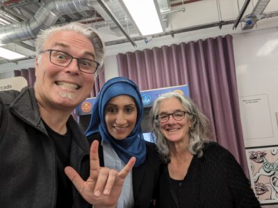 Christopher Patnoe, Sam Latif, and Lainey Feingold smiling at Google's Accessibility Discovery Centre in London