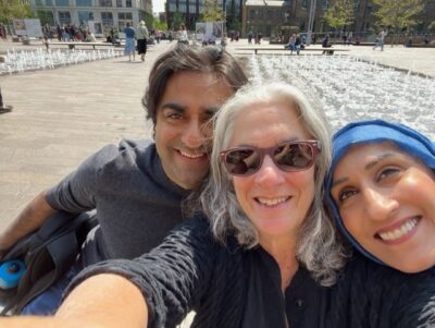 Sam Latif, Adi Latif, and Lainey Feingold smiling in London sunshine 